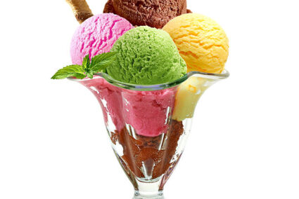 Ice cream scoops in sundae cup on white background Ice cream scoops in sundae cup on white background