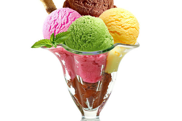 Ice cream scoops in sundae cup on white background Ice cream scoops in sundae cup on white background